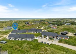 Centrums- og strandnær ferielejlighed med gratis entré til pool