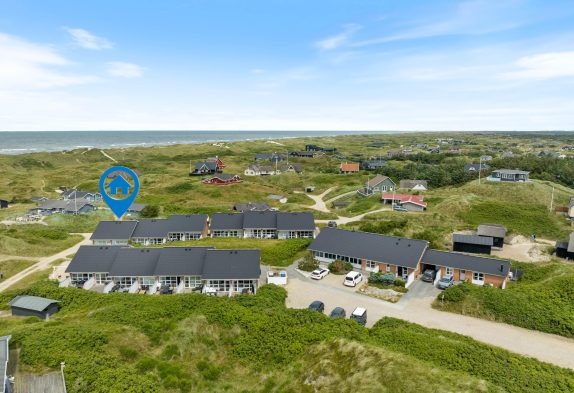 Centrums- og strandnær ferielejlighed med gratis entré til pool