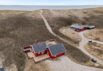Charmantes Ferienhaus mit Kamin in direkter Strandlage – Årgab (Bild  1)