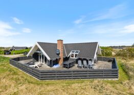 Ferienhaus mit geschlossener Terrasse nah am Leuchtturm