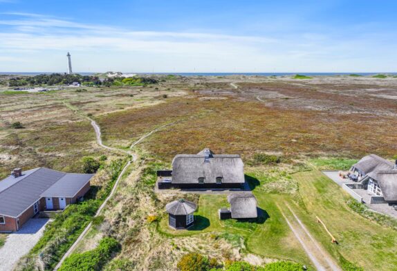 Charmantes Reetdachhaus mit Blick auf den Leuchtturm
