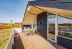Hus på lyngklædt grund med lukket terrasse og carport (billede 21)